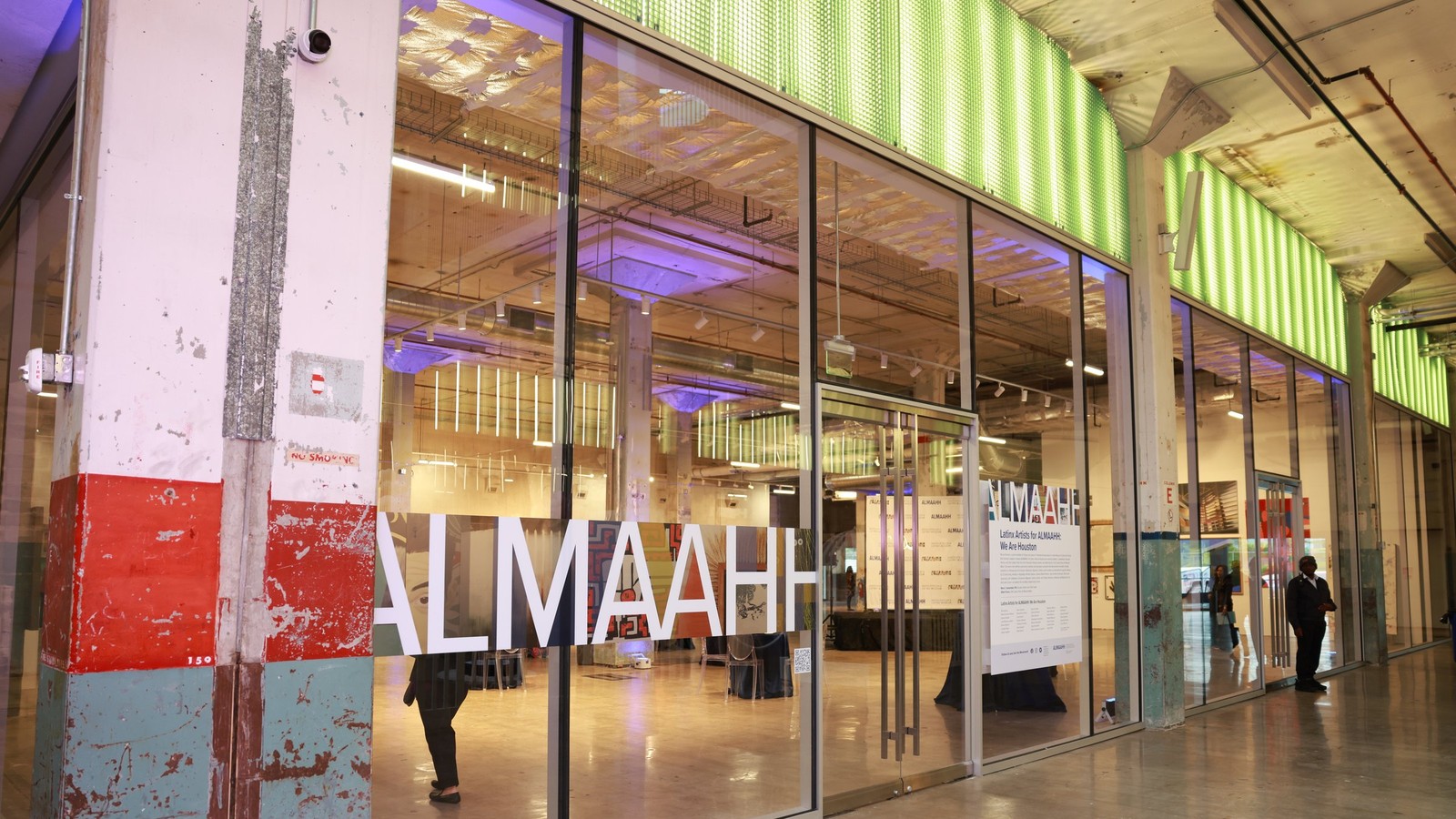 ALMAAHH program activation at POST Houston with the organization's name displayed across the glass storefront.